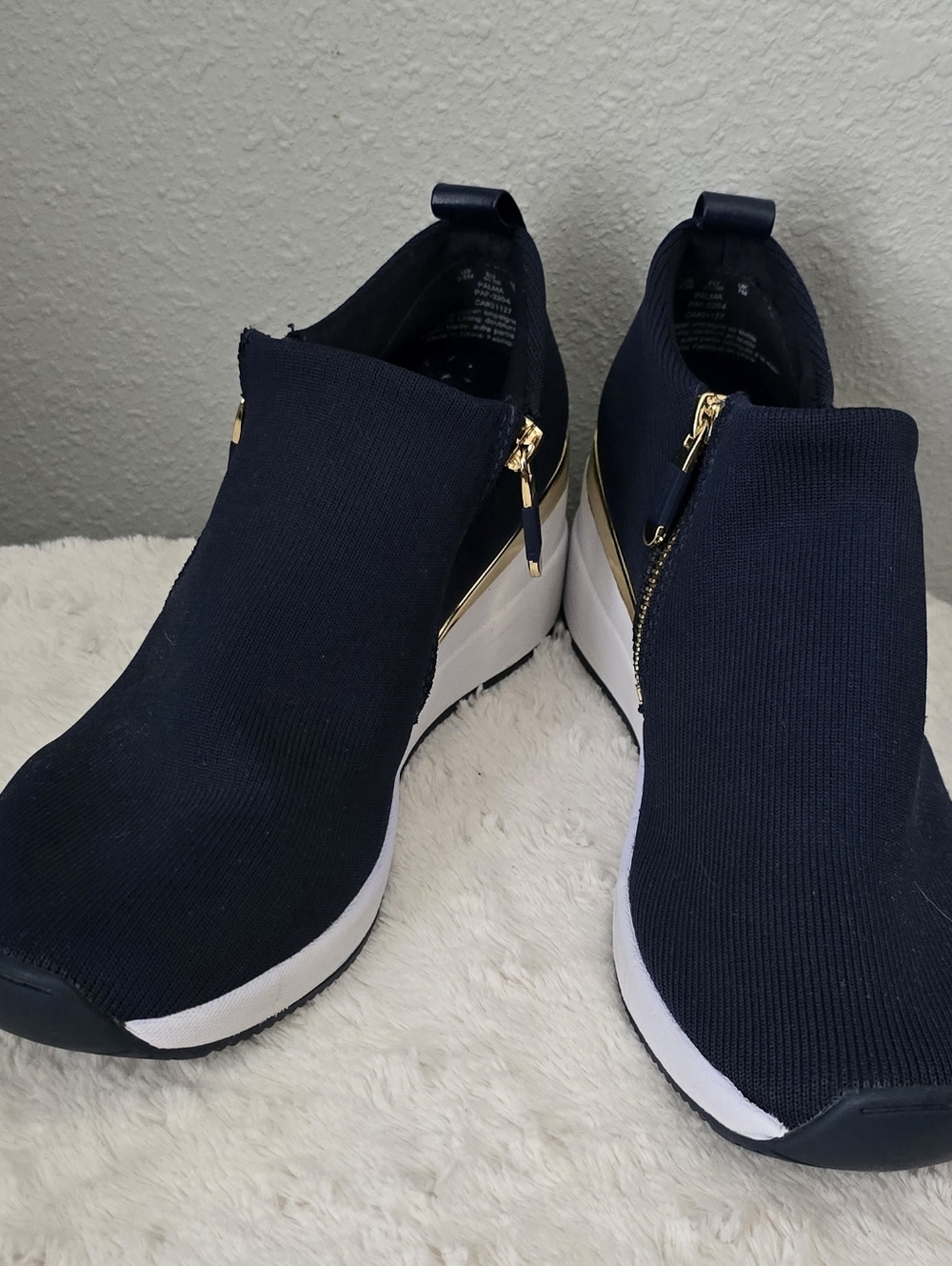 DKNY Navy Slip-On Wedge Sneakers with Gold Zipper